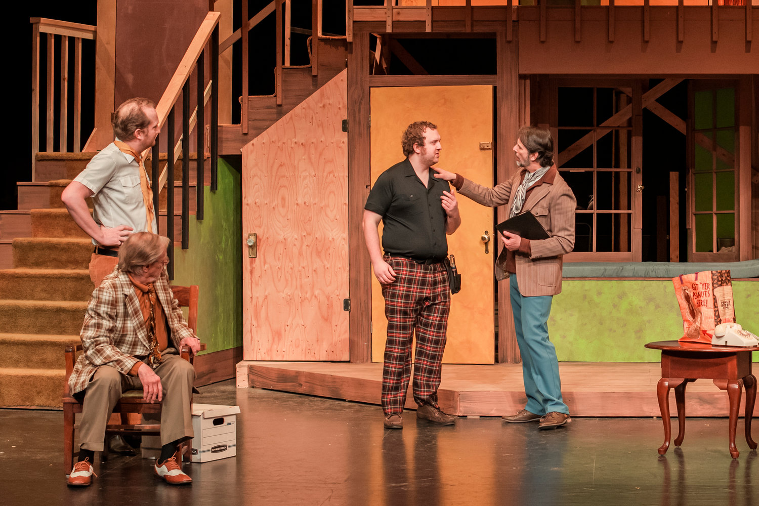 Seth MacNeely playing Lloyd Dallas, far right, puts his hand on the shoulder of Joe Pettit playing Tim Allgood, during dress rehearsals for the “Noises Off,” play at Centralia College Friday afternoon.