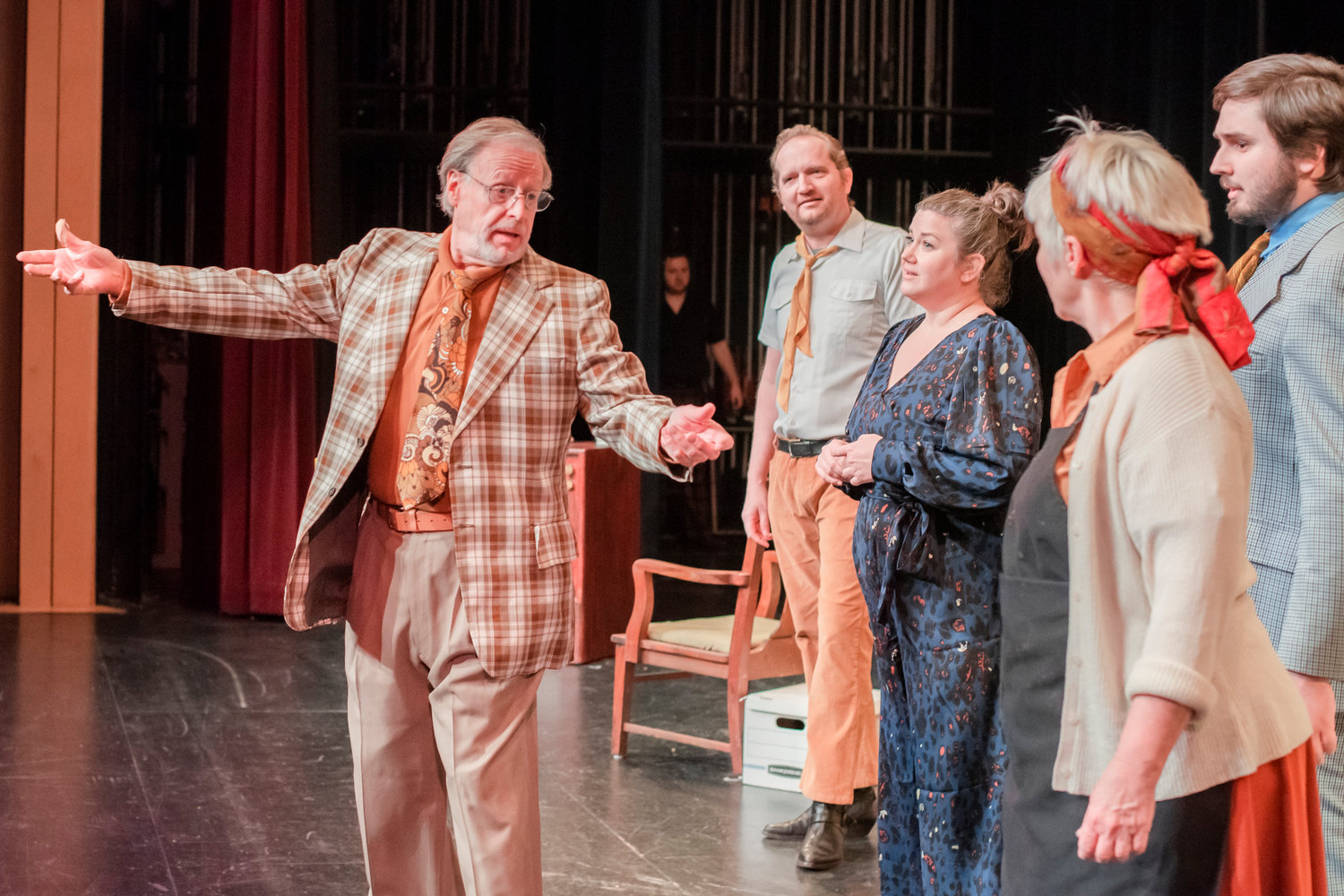 D. Douglas Lukascik as Selsdon Mowbray, far left, performs alongside actors and actresses on stage during dress rehearsals for the “Noises Off,” play at Centralia College on Friday.