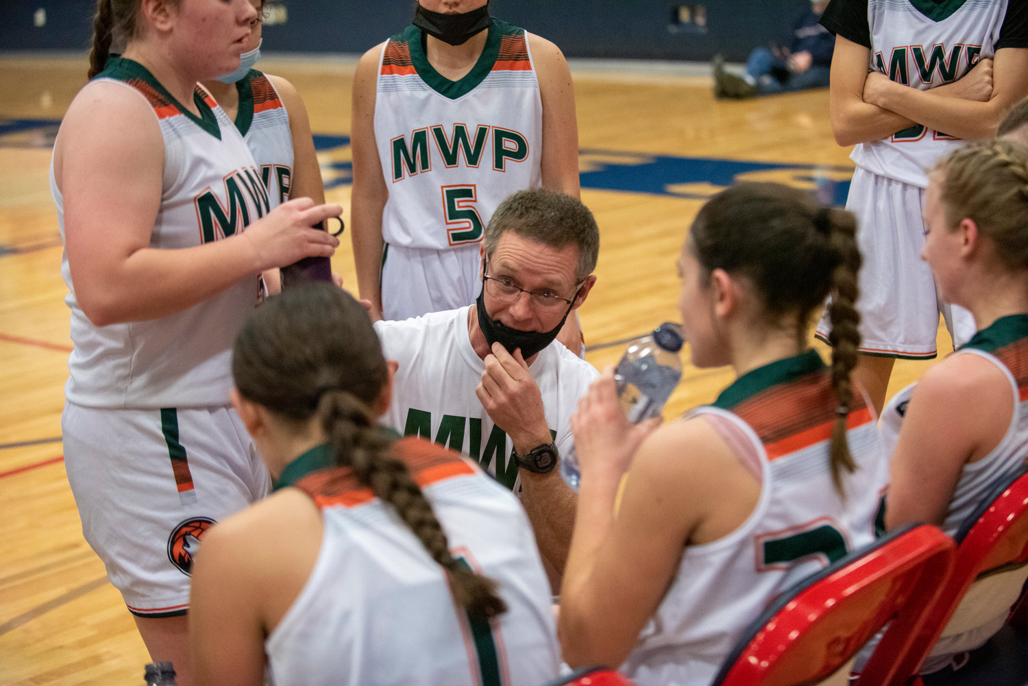 Morton-White Pass coach Curt Atkinson talks with his team during a timeout against Winlock on Feb. 8.