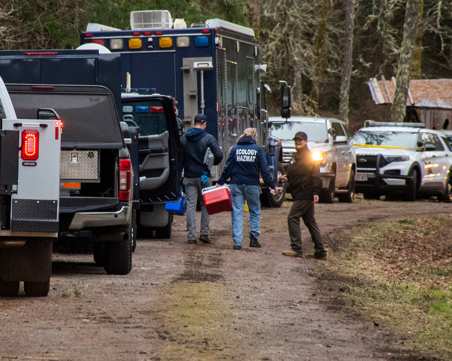 Ecology Hazmat crews work to remove non-active materials from the 20000 block of Neat Road Southeast Tuesday afternoon in Yelm.