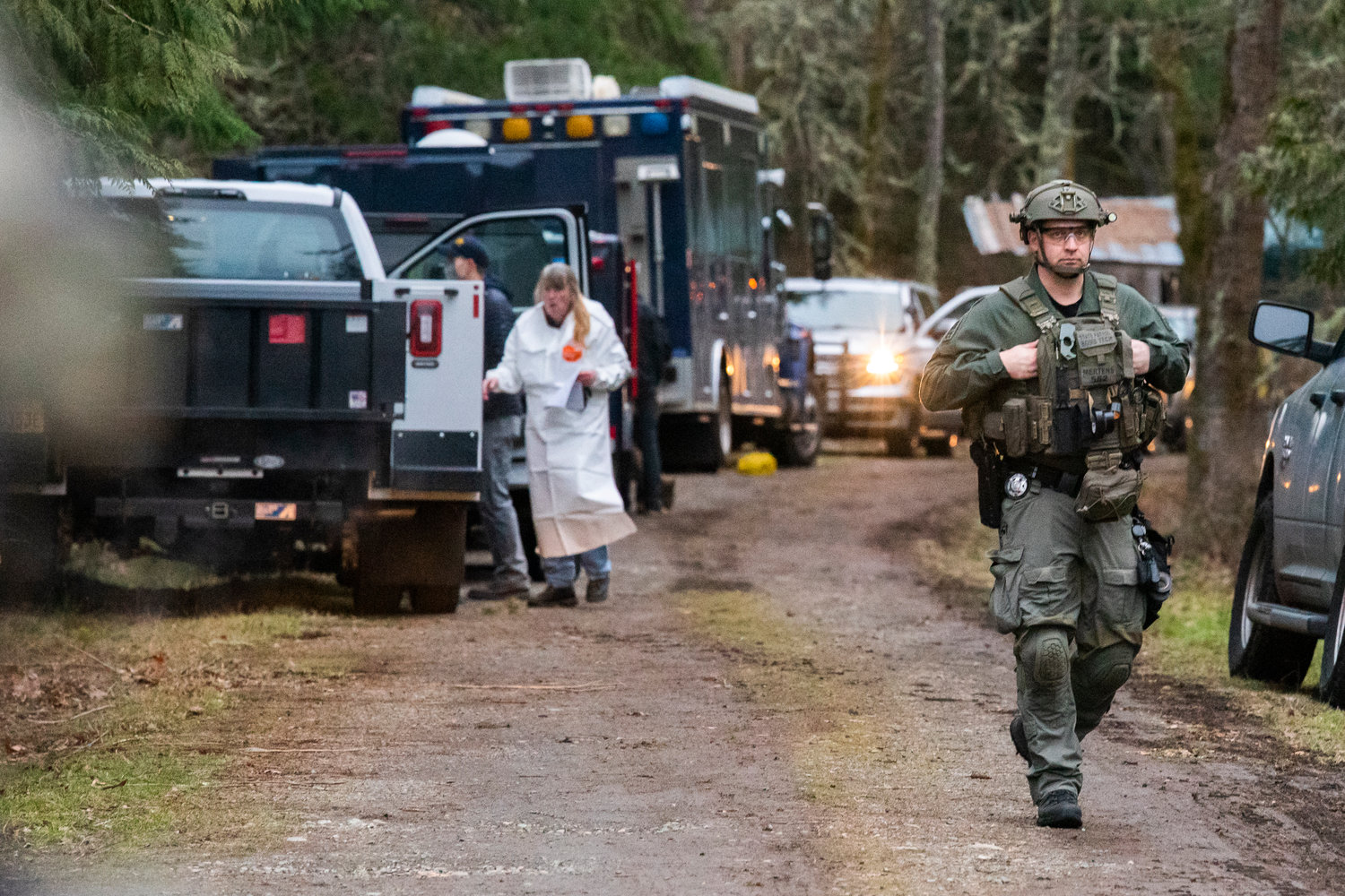 Ecology Hazmat crews work to remove non-active materials from the 20000 block of Neat Road Southeast as bomb techs detonate potentially dangerous materials Tuesday afternoon in Yelm.