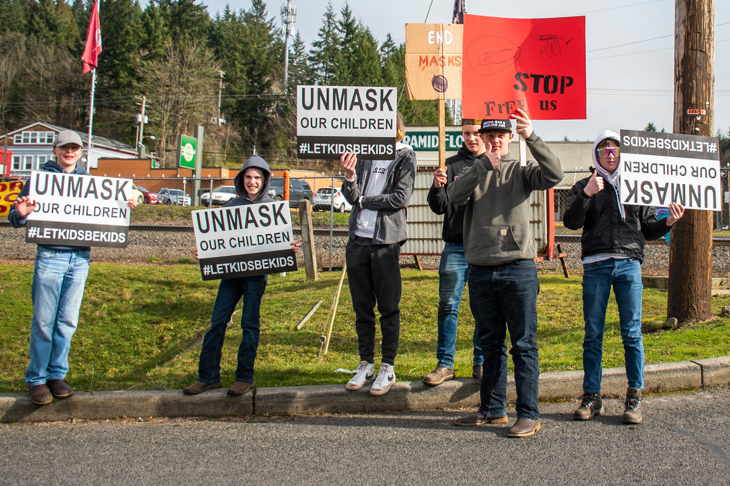 Students protest the mask mandate Tuesday afternoon in downtown Winlock.