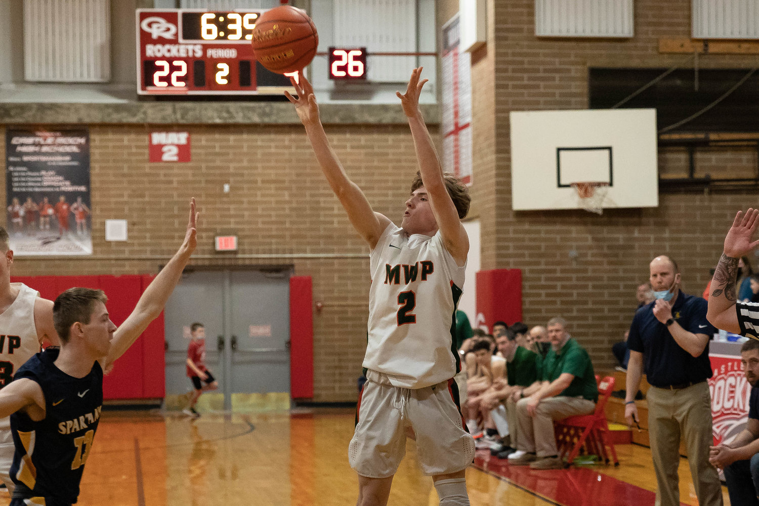 MWP guard Judah Kelly takes a 3-pointer against Forks in the 2B District 4 quarterfinals at Castle Rock Feb. 9.