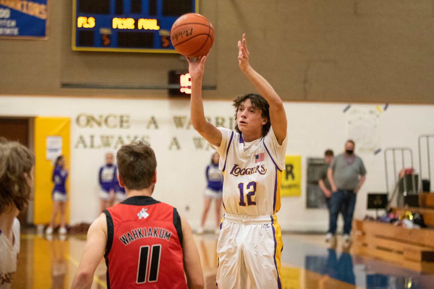 Onalaska senior Mason Ulery (12) shoots a 3-pointer in a loss to Wahkiakum in the district playoffs on Feb. 9 at Rochester High School.