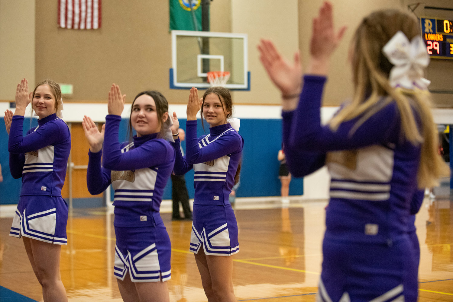 Onalaska cheerleaders during a district playoff game against Wahkiakum on Feb. 9 at Rochester High School.