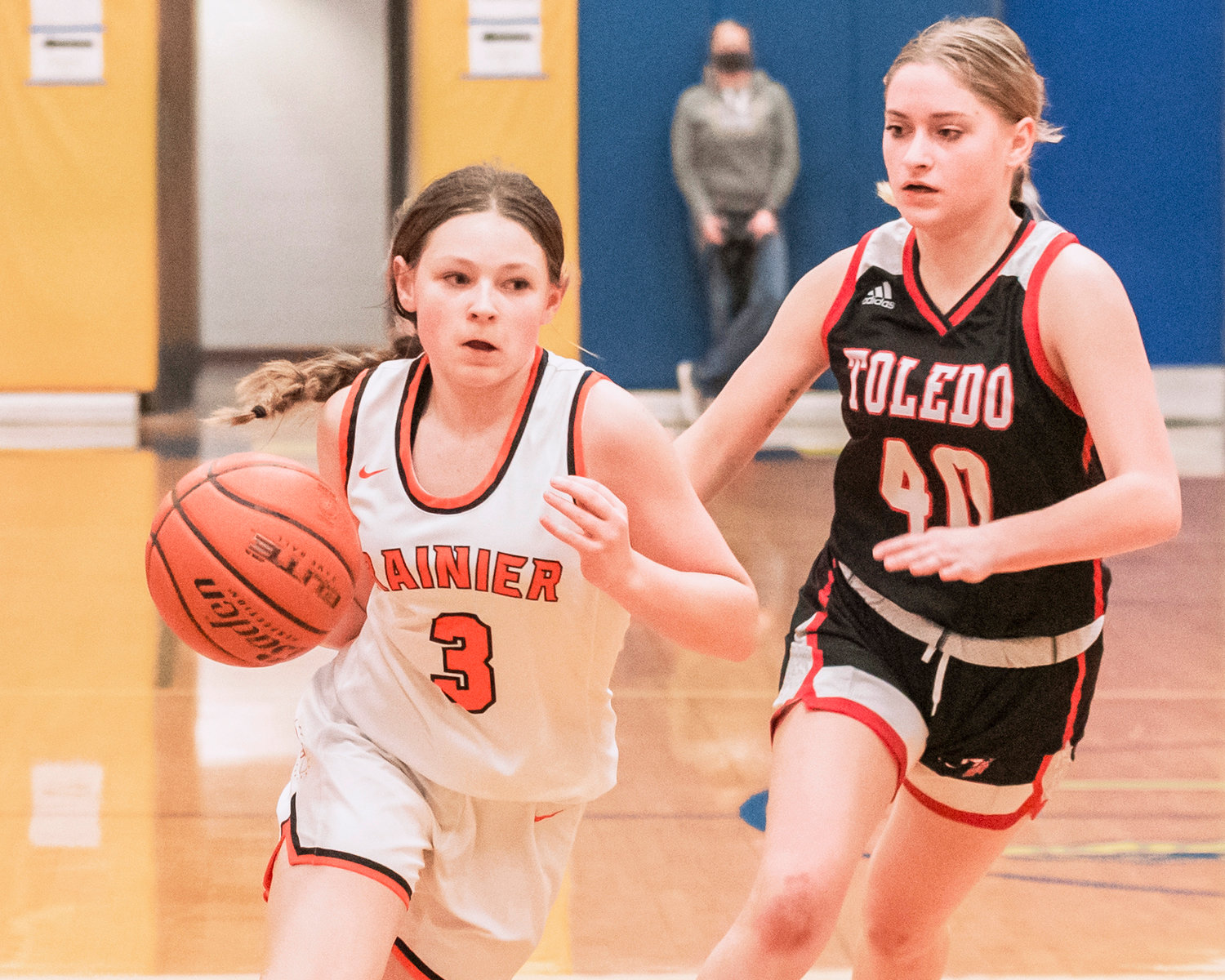 Rainier’s Brooklynn Swenson (3) dribbles the ball past a Toledo defender Thursday night during a game at Rochester High School.