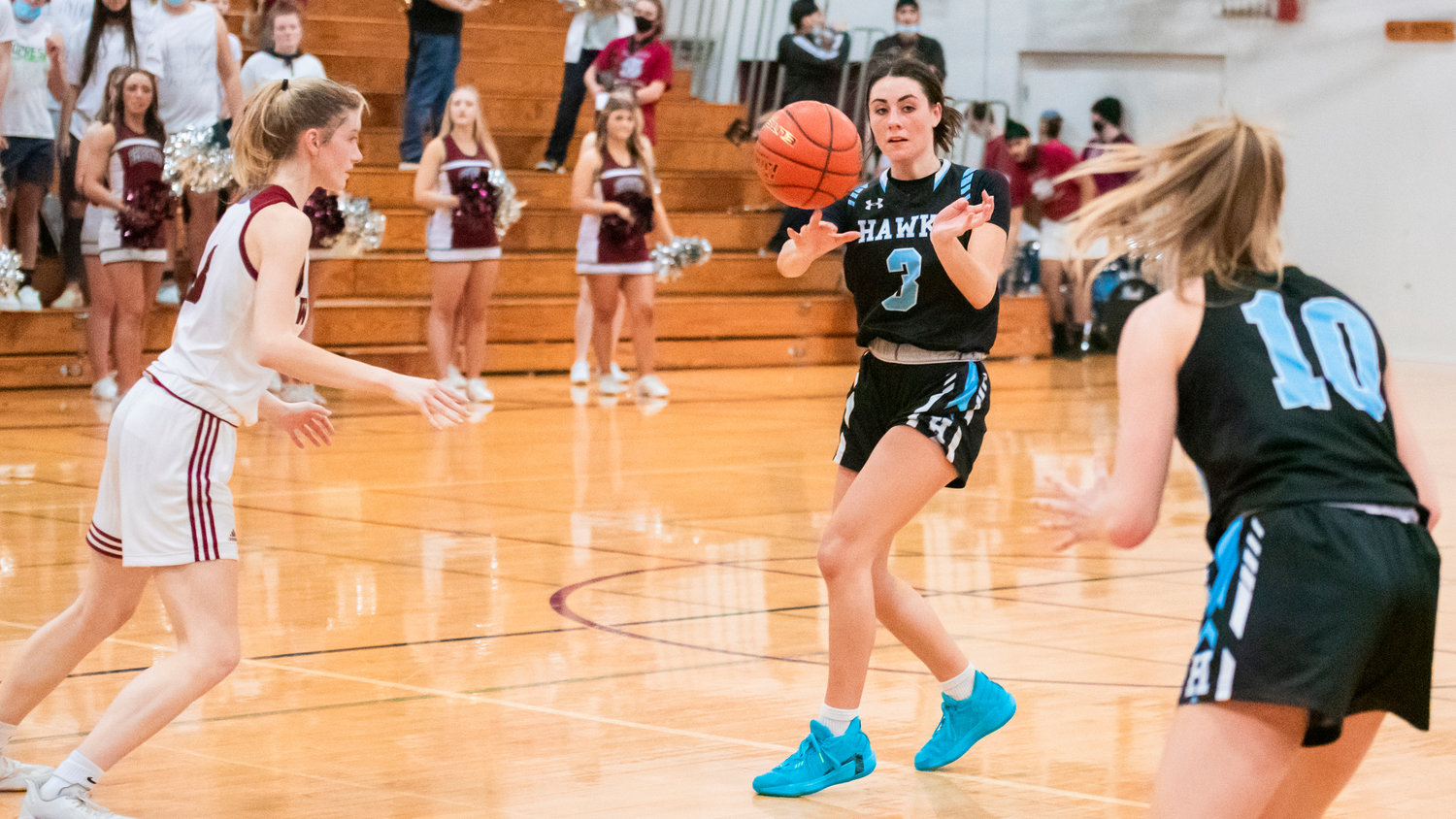 Hockinson senior Gracie Brammer (3) completes a pass to Kylie Ritter (10) during a game in Chehalis Friday night.