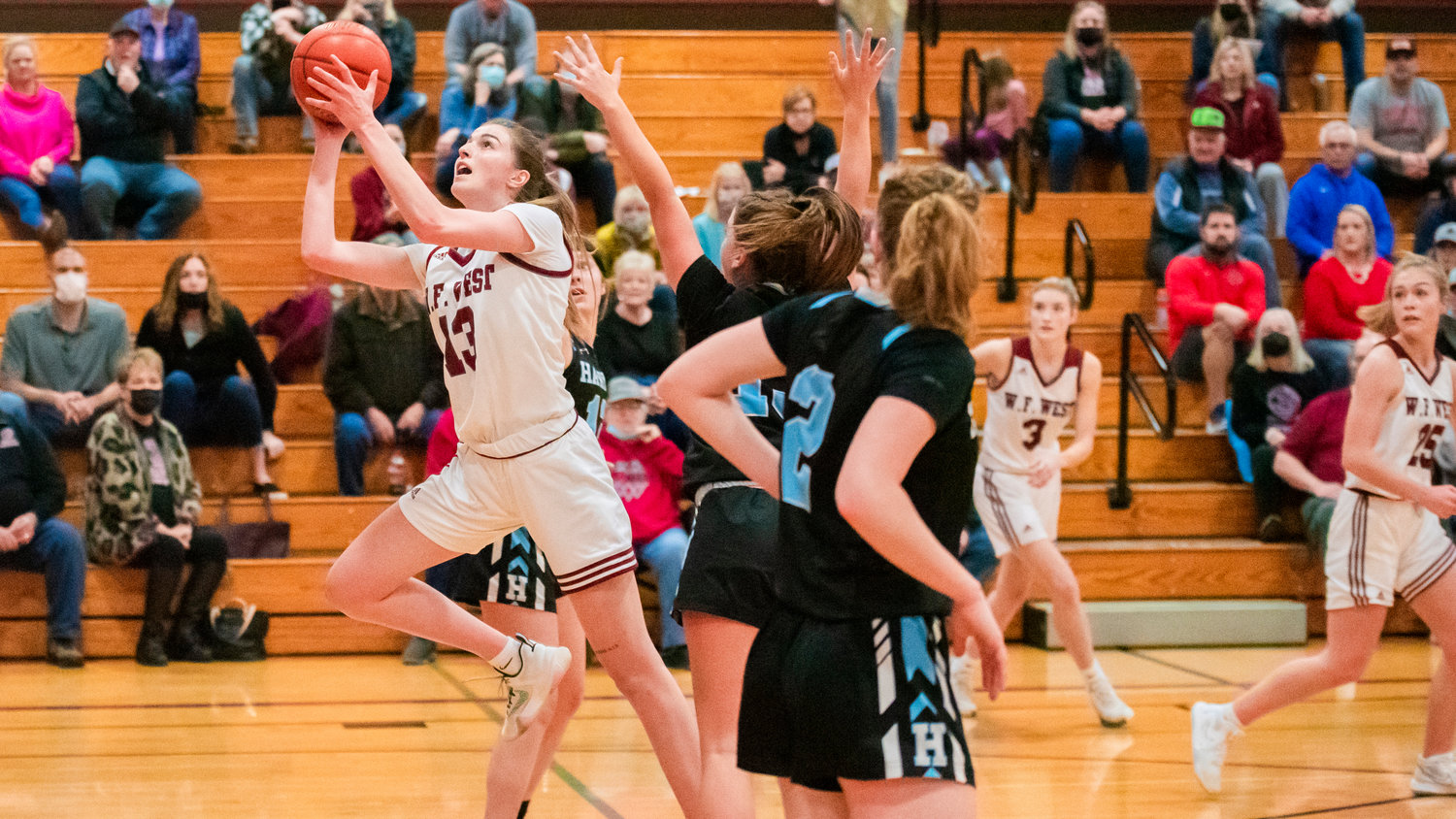 W.F. West senior Drea Brumfield (13) drives in to score during a game Friday night in Chehalis.