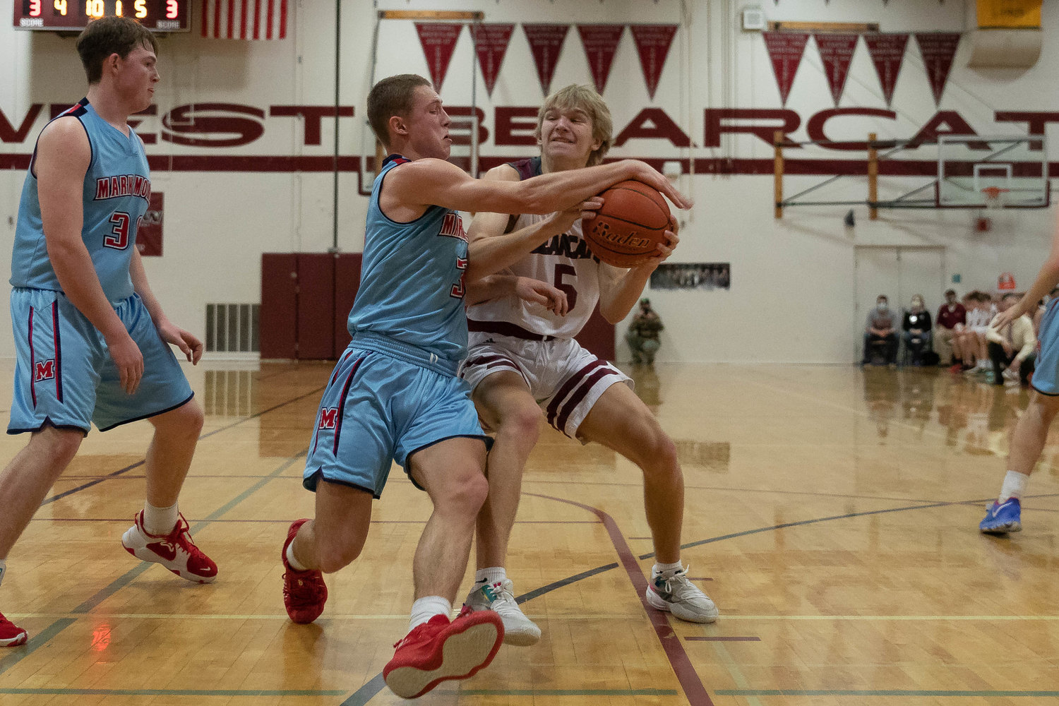Bearcat guard Dirk Plakinger is stripped by Mark Morris guard Deacon Dietz in a loss to Mark Morris in the opening round of the 2A District IV playoffs in Chehalis Feb. 12.