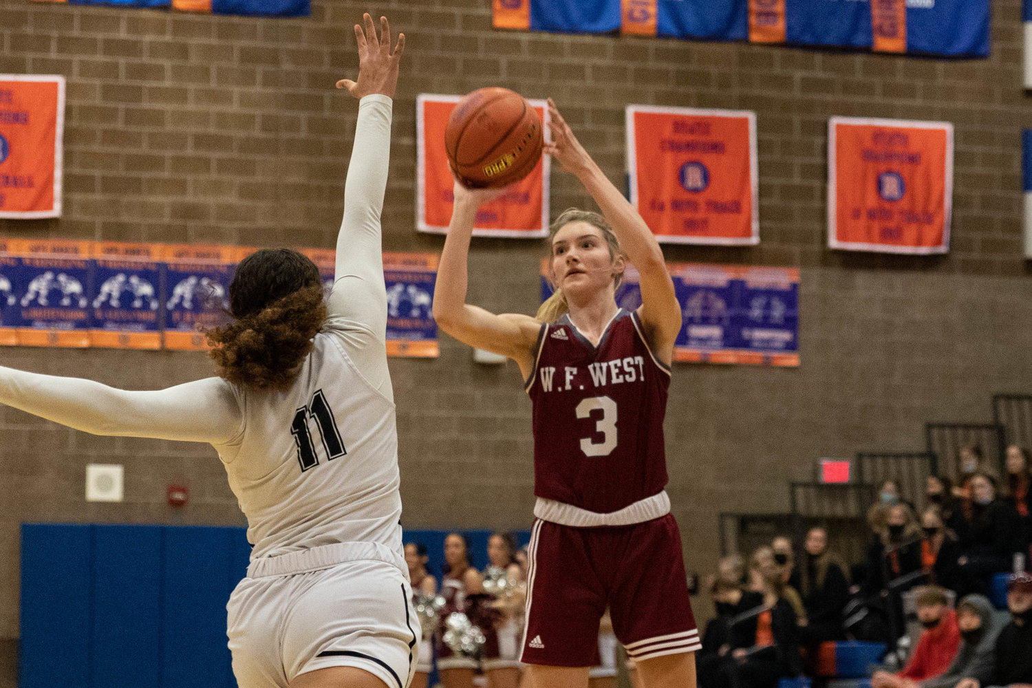 W.F. West forward Lexi Roberts takes a 3-pointer against Hudson's Bay in the 2A District IV semifinals at Ridgefield Feb. 14.
