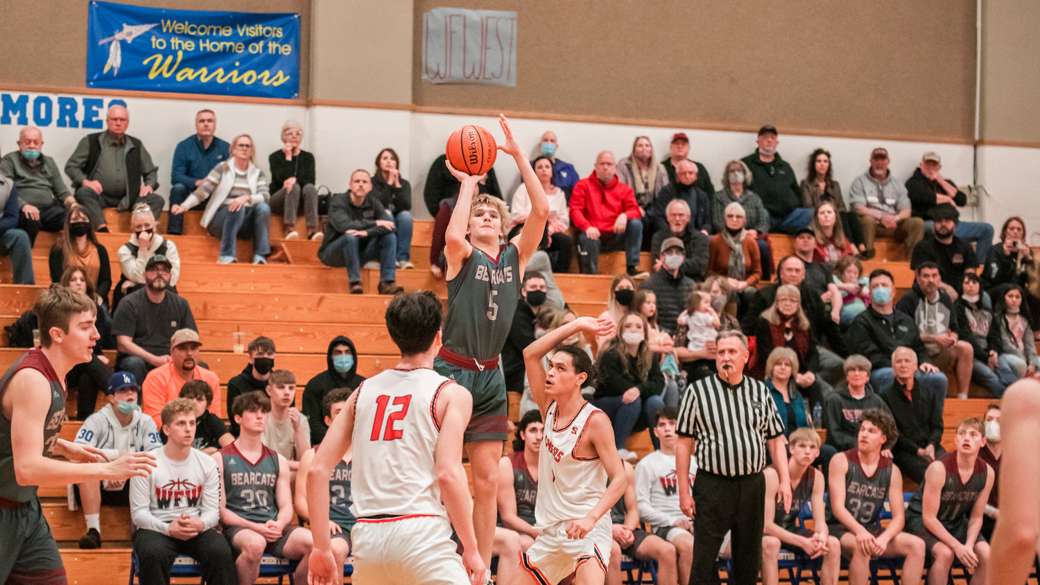 W.F. West senior Dirk Plankinger (5) puts up a shot Tuesday night during a game against Shelton.