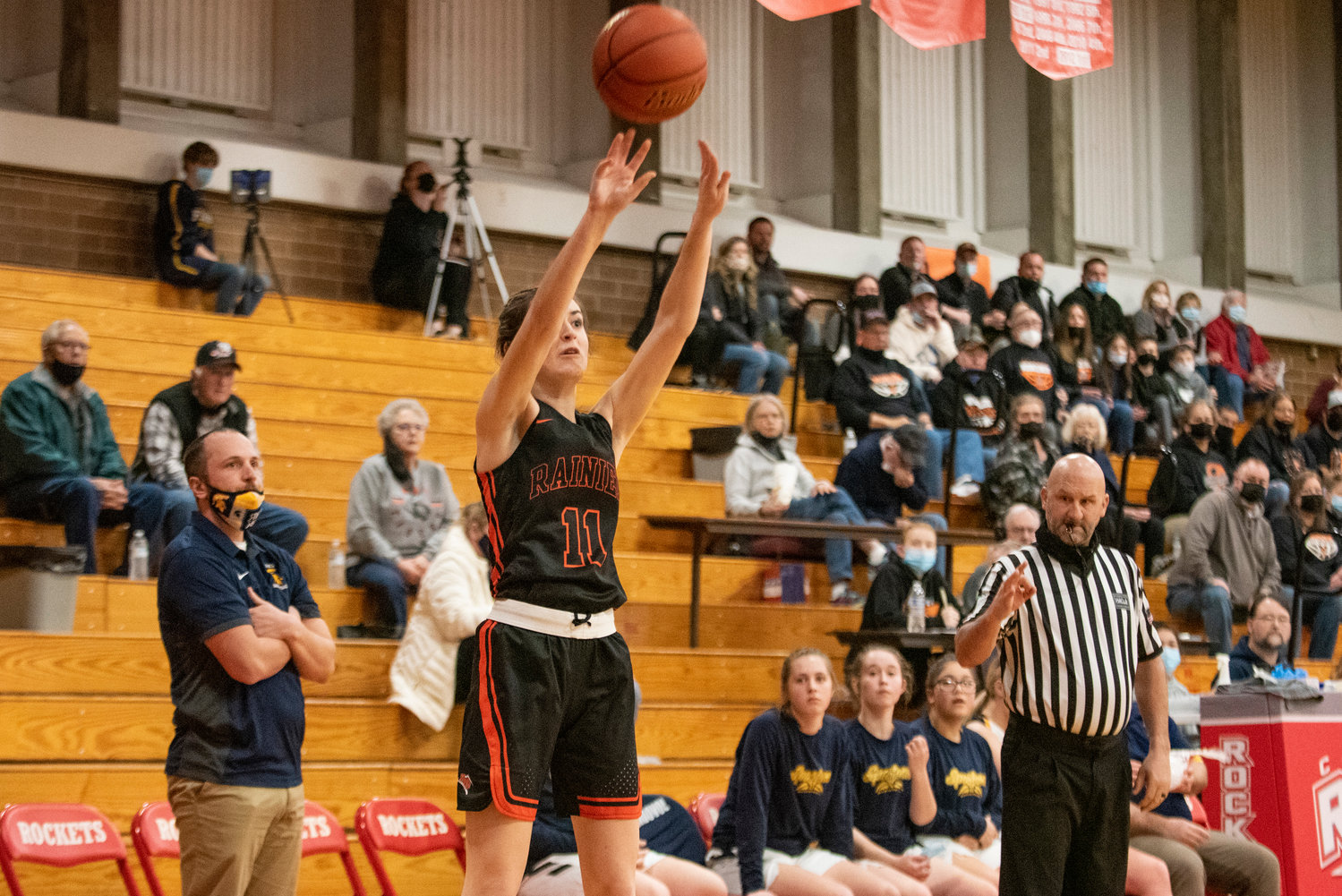 Rainier's Faith Boesch (11) shoots one of her 11 3-pointers on the night in a district-playoff win over Forks on Feb. 15.