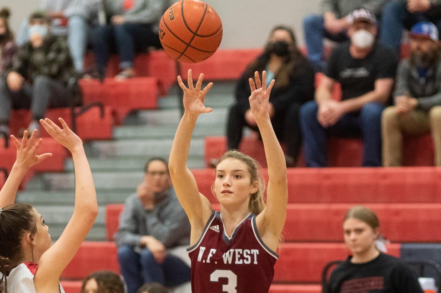 W.F. West senior Lexi Roberts passes to an open teammate against R.A. Long Feb.16