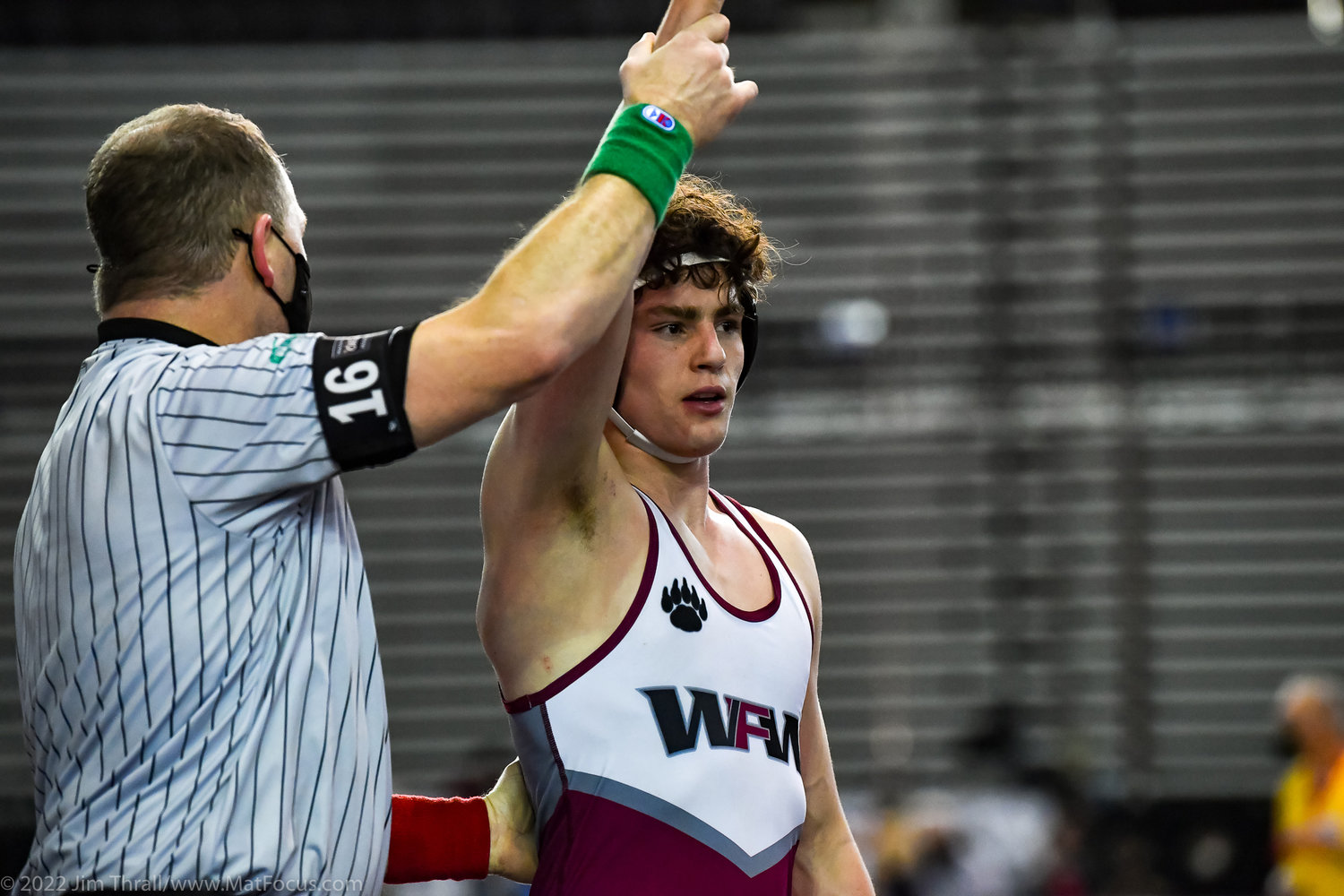 A W.F. West wrestler raises his hand in victory at Mat Classic XXXIII at the Tacoma Dome on Friday.