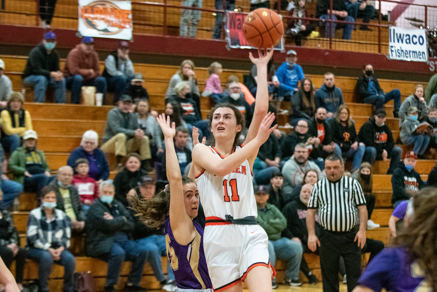 Rainier’s Faith Boesch drives for a floater against Onalaska in the district playoffs Feb. 19 at W.F. West High School.