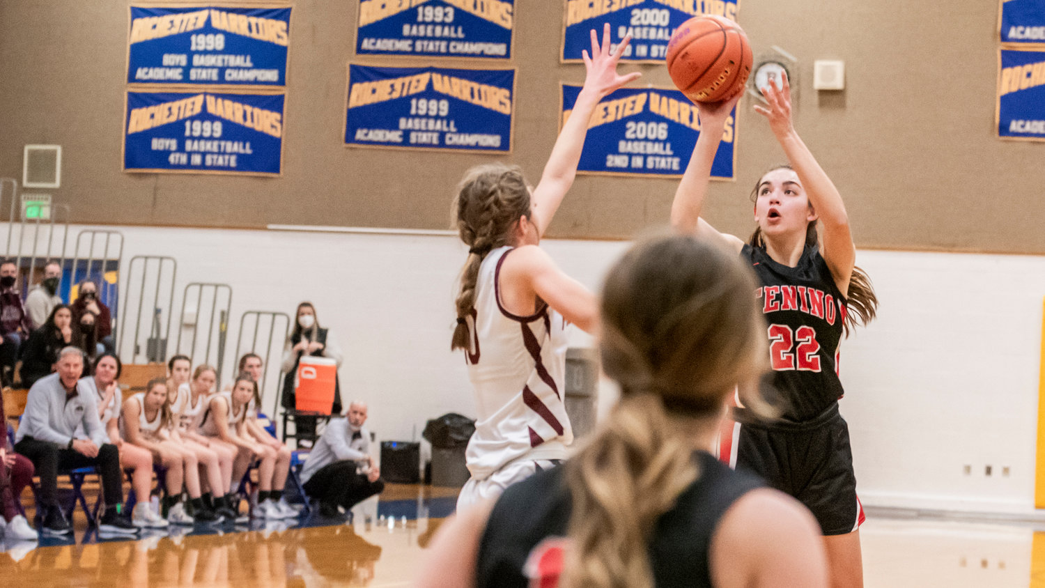 Tenino’s Ashley Schow (22) looks to shoot over a Montesano defender during a game Saturday in Rochester.