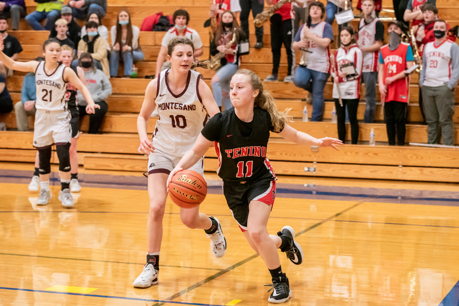 Tenino’s Megan Letts (11) drives in with the ball on Montesano defenders during a game Saturday at Rochester High School.