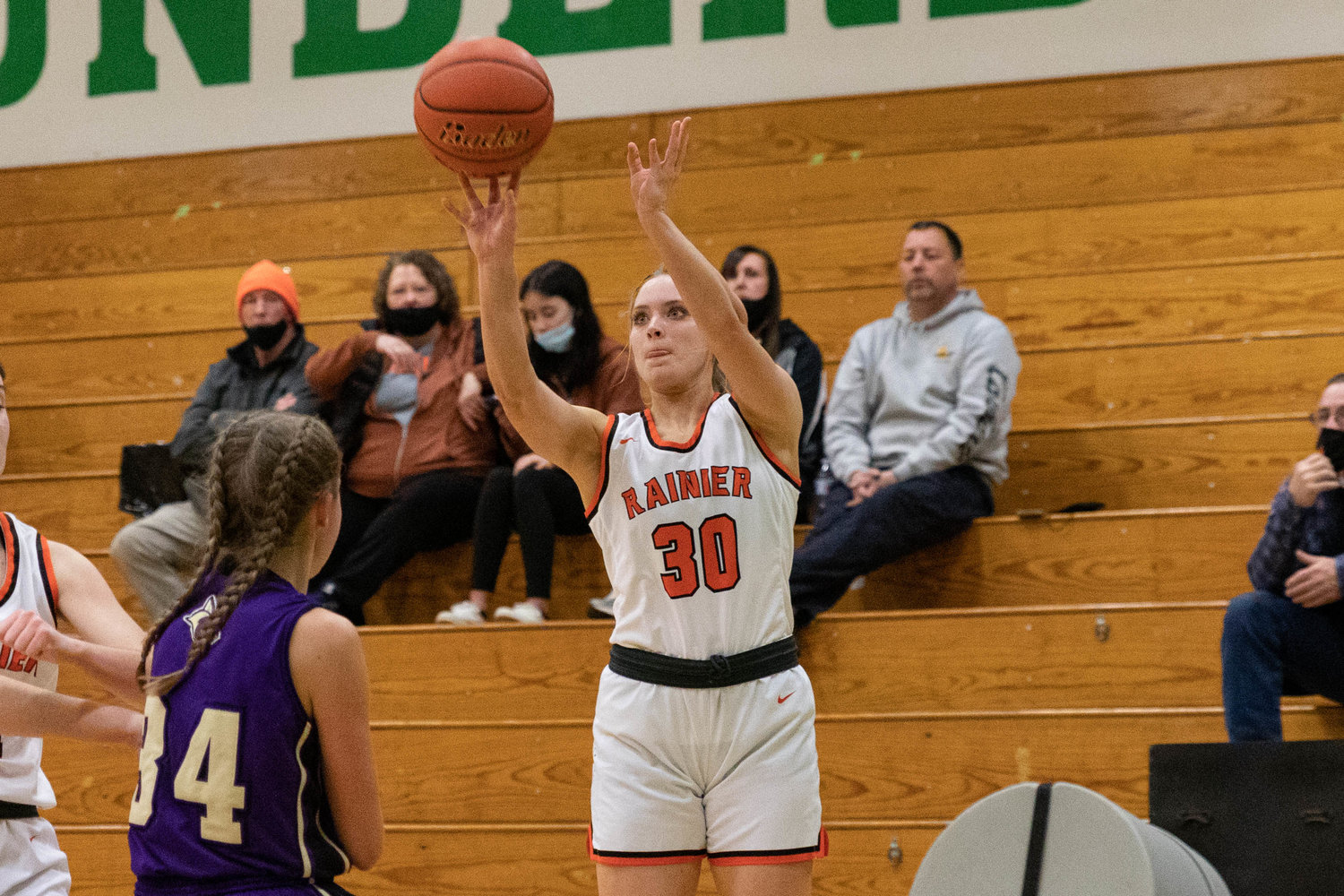 Rainier forward Isabella Holmes takes a 3-pointer against Columbia (Burbank) in the regional round of the state tournament at Tumwater Feb. 25.