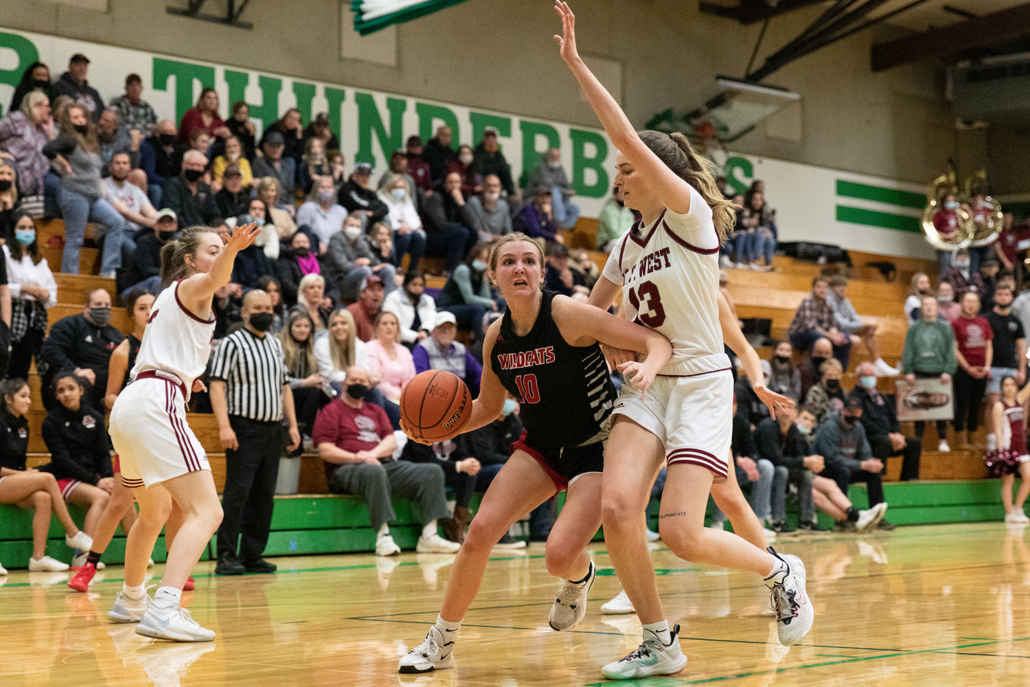 Archbishop Murphy guard Hannah Humphrey drives against W.F. West's Drea Brumfield in the regional round of the state tournament at Tumwater Feb. 25.
