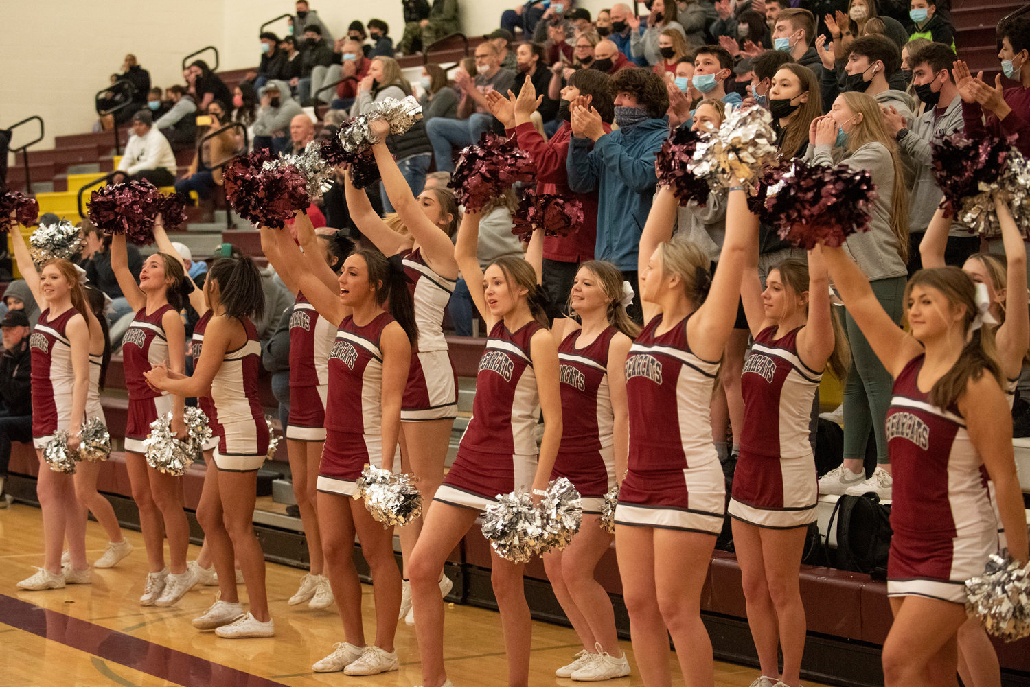 W.F. West’s cheerleaders and student section celebrate a Bearcat bucket against Franklin Pierce in the Regional playoffs Feb. 26.