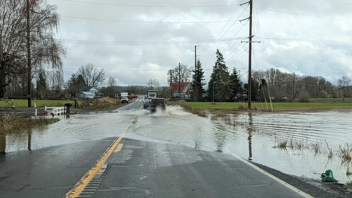 Water is pictured over state Route 6 near Twin Oaks Road in Adna Tuesday.