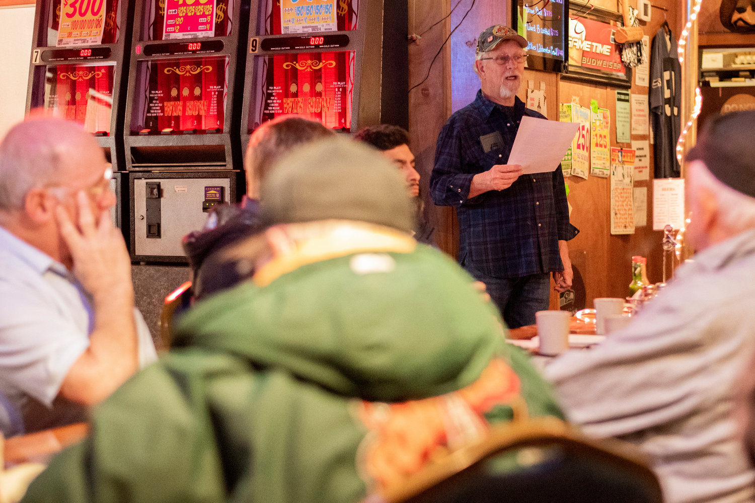 Jack Kerr, a marine veteran who works with his wife Kathy Heimbigner to organize meetings with other local veterans, introduces speakers at the Tall Timber Restaurant Lounge in Randle. Kathy A. Heimbigner is the author of this commentary.