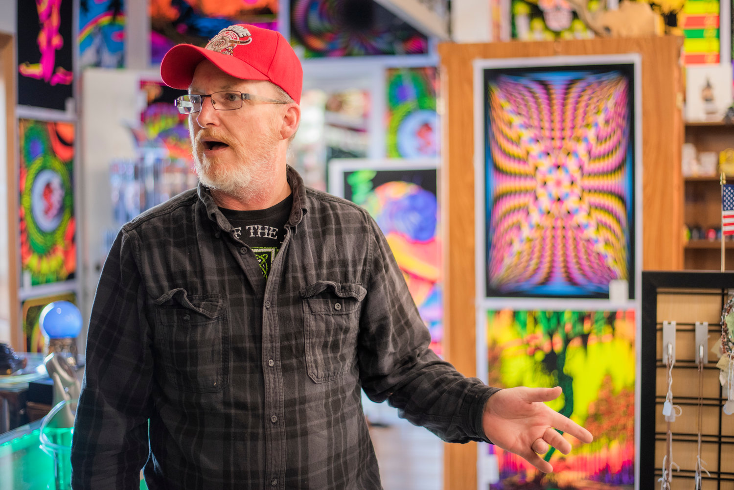 Paul Bromm talks about black light posters hanging around his shop StrangeLands in downtown Centralia.