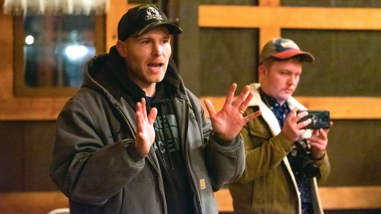 Vincent James, of Idaho, asks questions at a Wednesday night Joe Kent town hall in Onalaska as someone accompanying him, who refused to reveal his name, records the event for a YouTube channel. James told The Chronicle he drove five hours to attend the town hall.