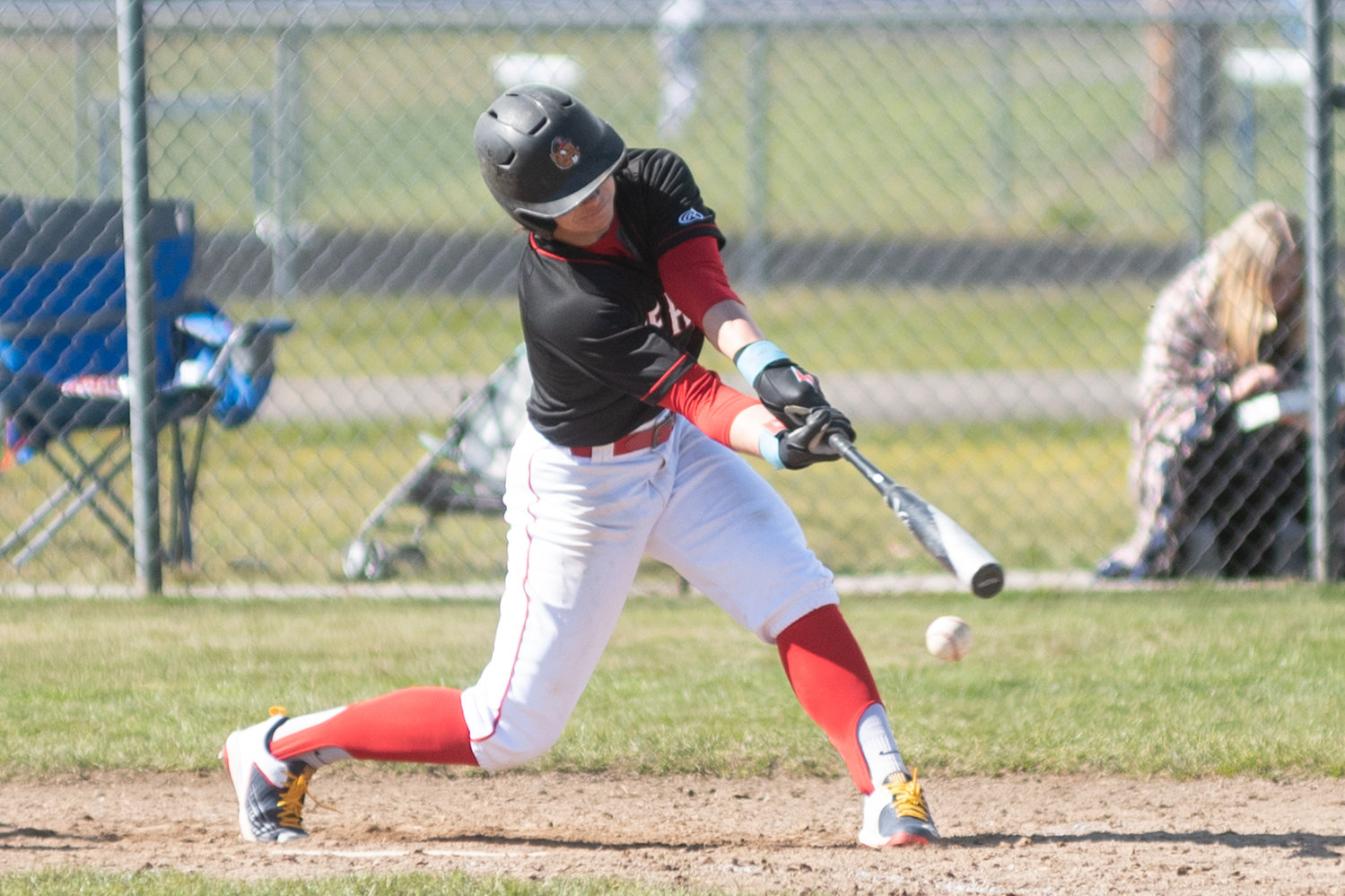 Tenino's Easton Snider takes a swing against Rochester in the Scatter Creek Derby March 12.