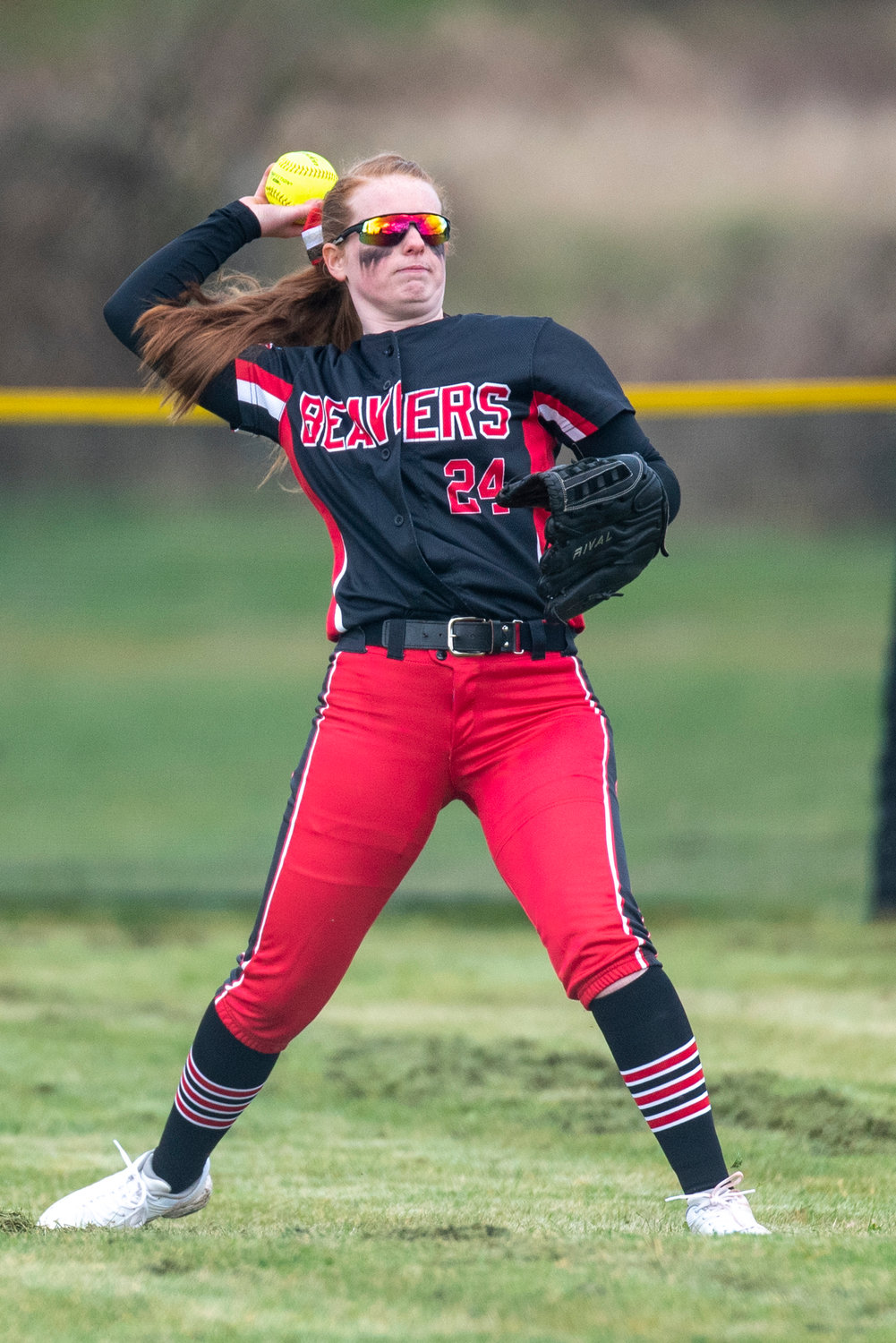 Tenino center fielder Abby Severse throws a Toledo hit back to the Beavers' infield on March 16.