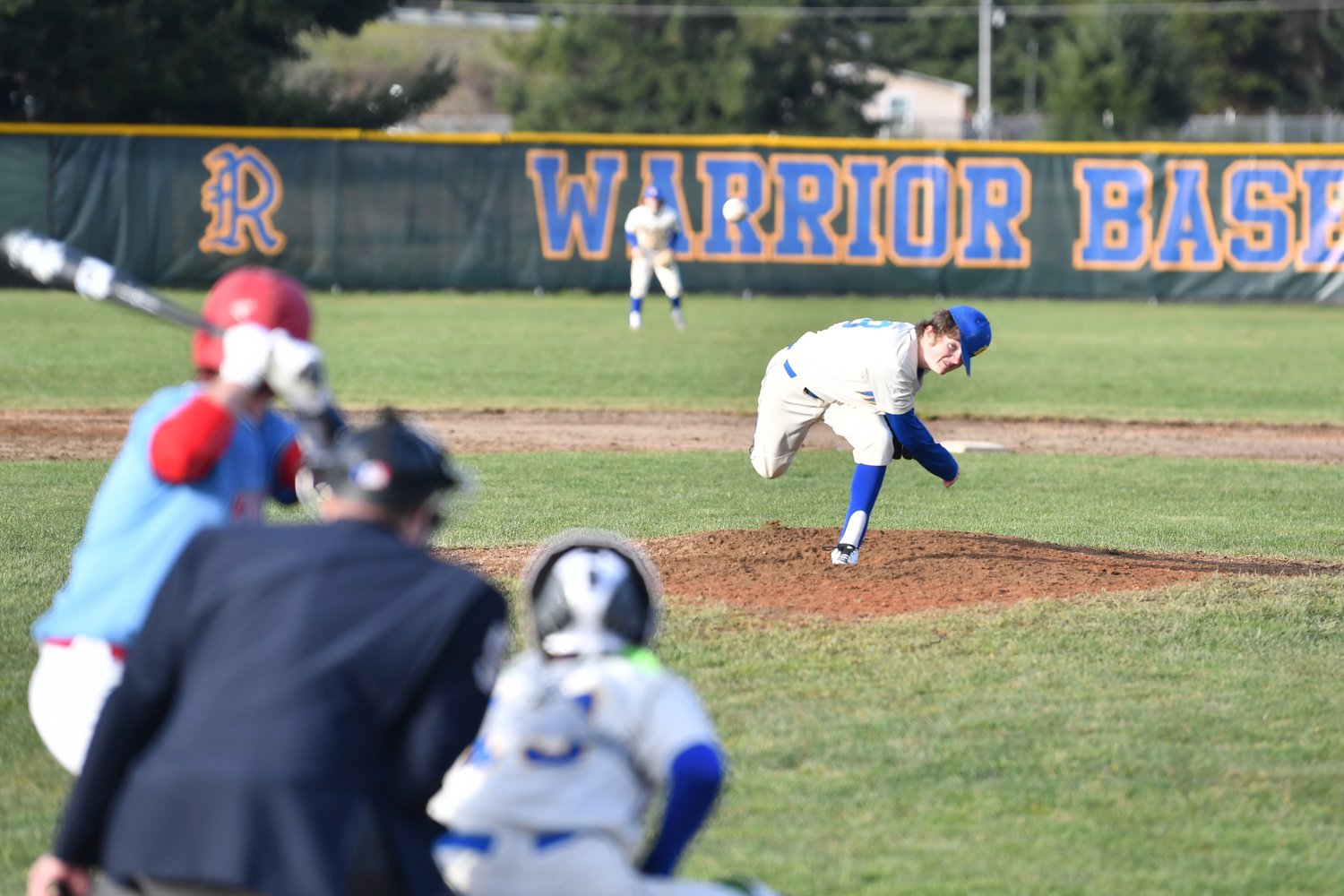 A Rochester player throws a pitch against Mark Morris March 16.