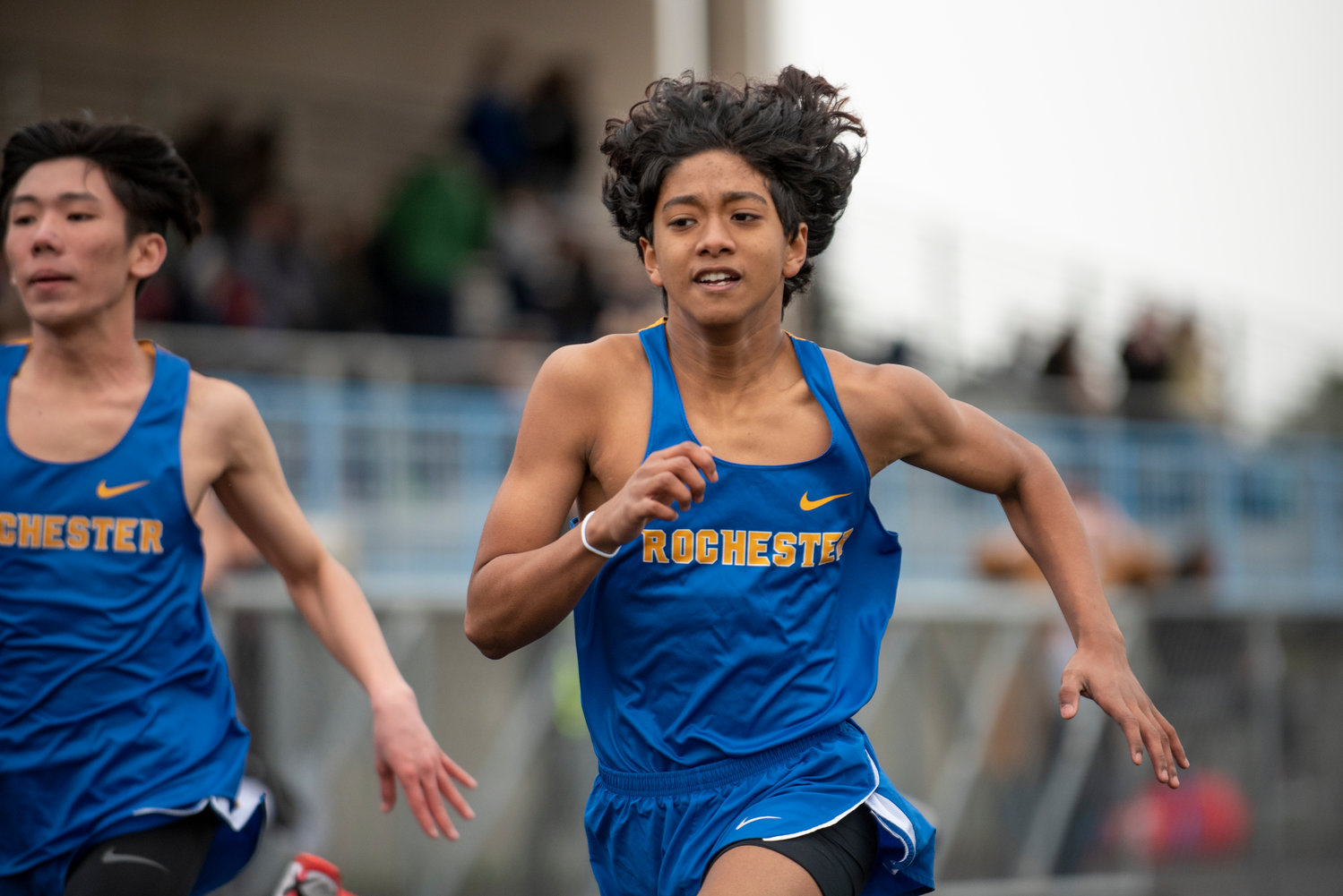 A Rochester runner sprints to the finish line in the boys 100-meter dash at a home meet on March 17.