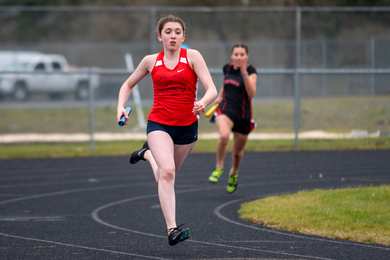 Black Hills' Kiley McMahon sprints during the Wolves' third leg of the 4x200-meter relay against Centralia on March 17 at Rochester High School.