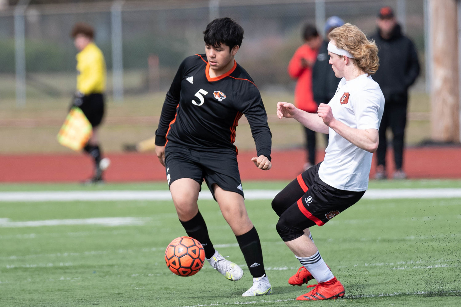 A Centralia player looks to keep the ball away from a Tenino defender March 19 at Tiger Stadium.