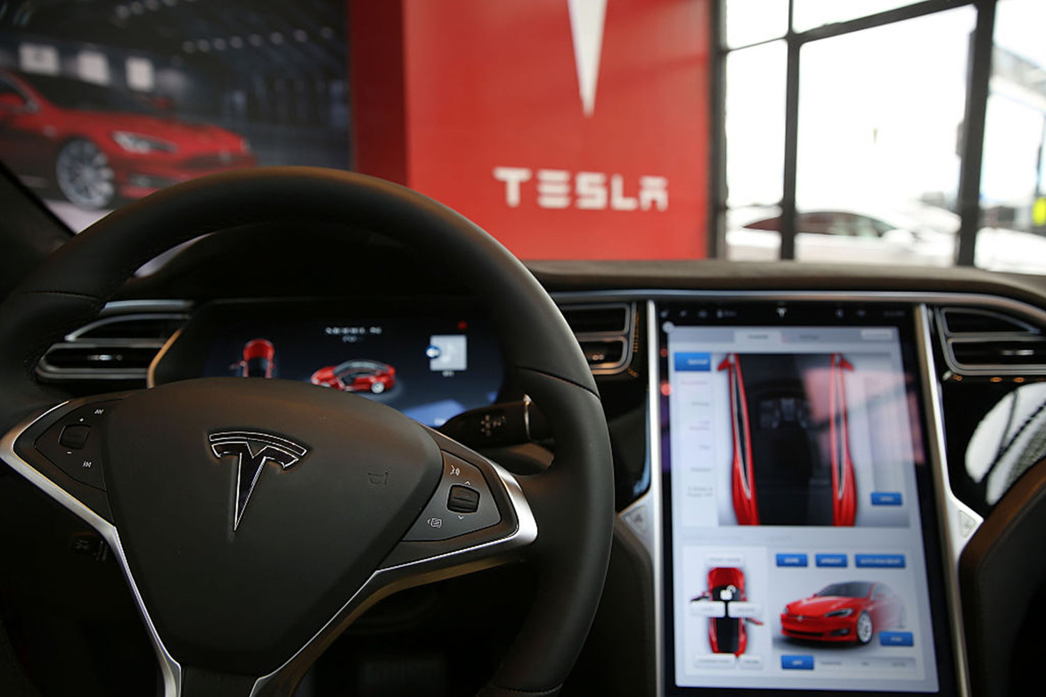 The inside of a Tesla vehicle is viewed as it sits parked in a new Tesla showroom and service center in Red Hook, Brooklyn on July 5, 2016 in New York City. (Spencer Platt/Getty Images/TNS)