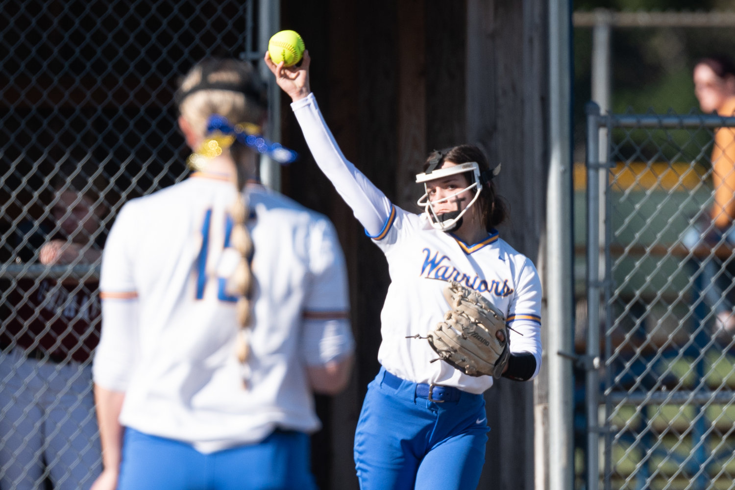Rochester's Layna Demers throws the ball back to Lakota Escott against W.F. West March 22.