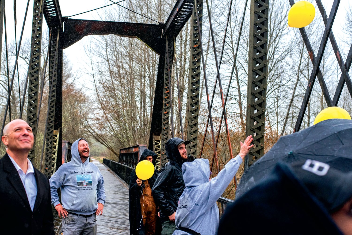 State Rep. Peter Abbarno and Lee Hines, the stepfather of Zachary Rager, smile as balloons are released Wednesday afternoon along the Willapa Trail.