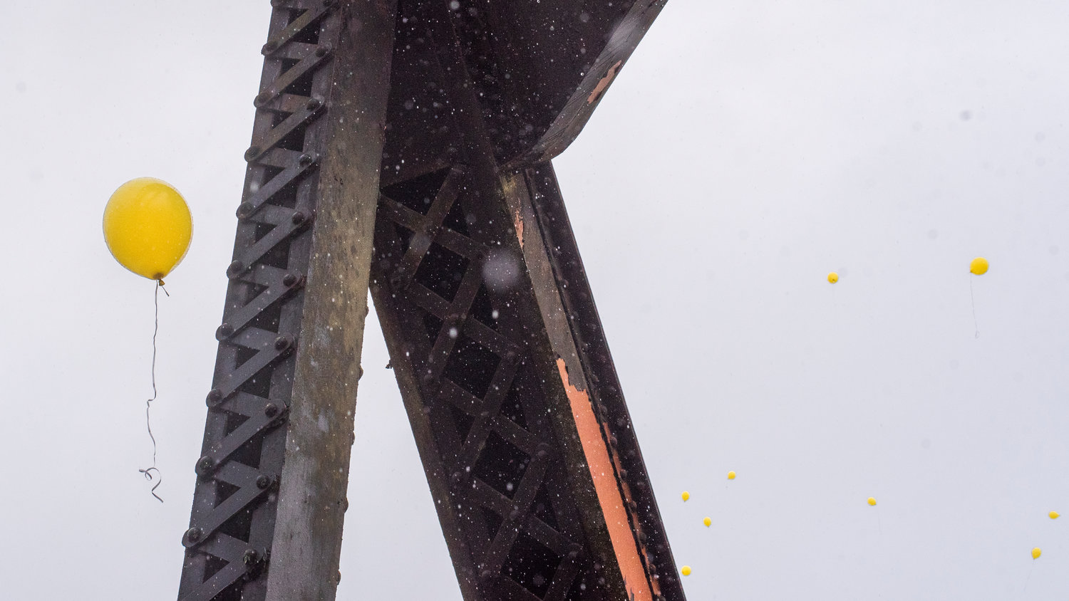 Balloons float by a bridge over the Chehalis River along the Willapa Hills Trail Wednesday afternoon during an event in remembrance of Zachary Rager.