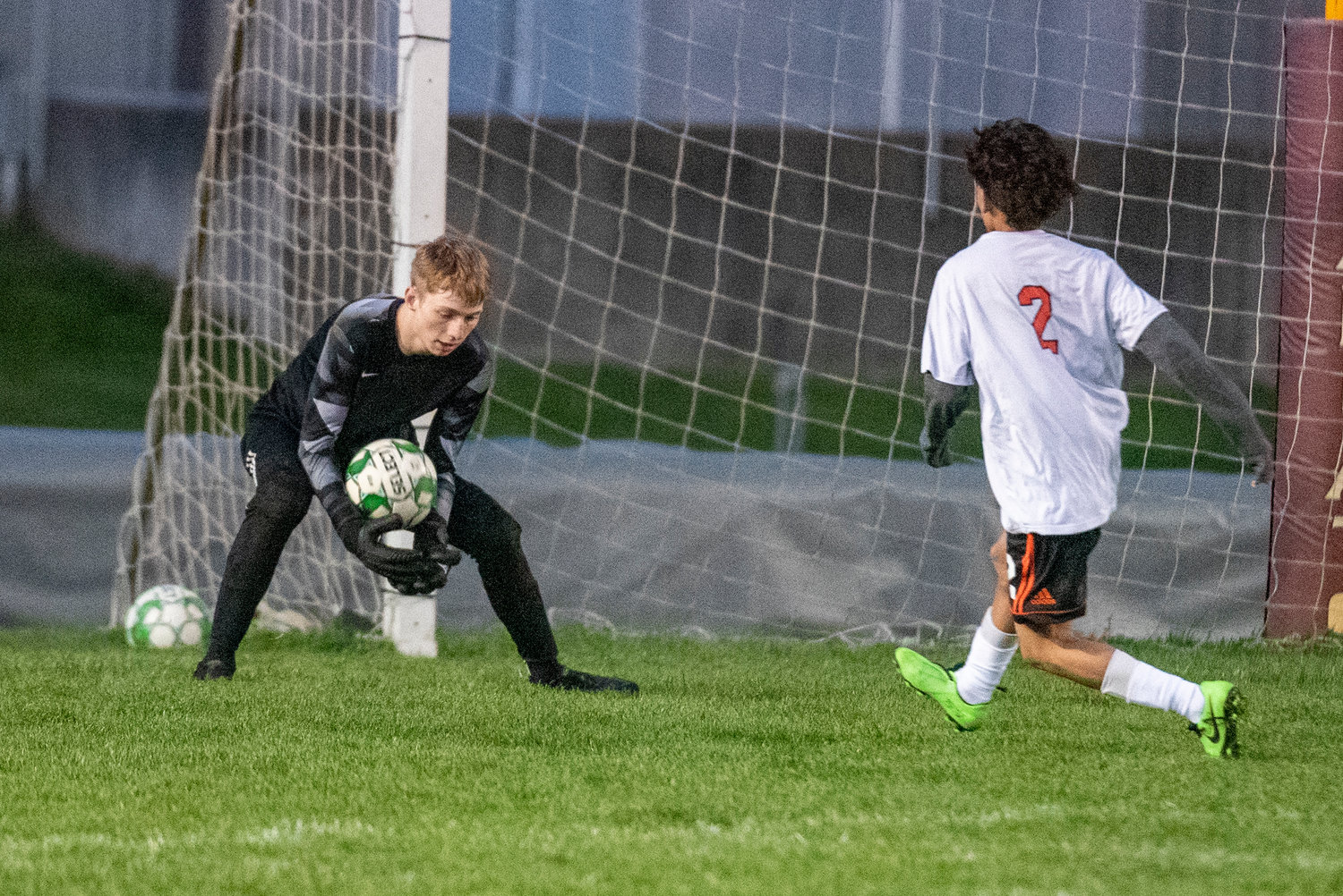 W.F. West keeper Hayden Sciera makes a stop against Centralia's Brayan Orellana-Gamez during a home game on March 25.
