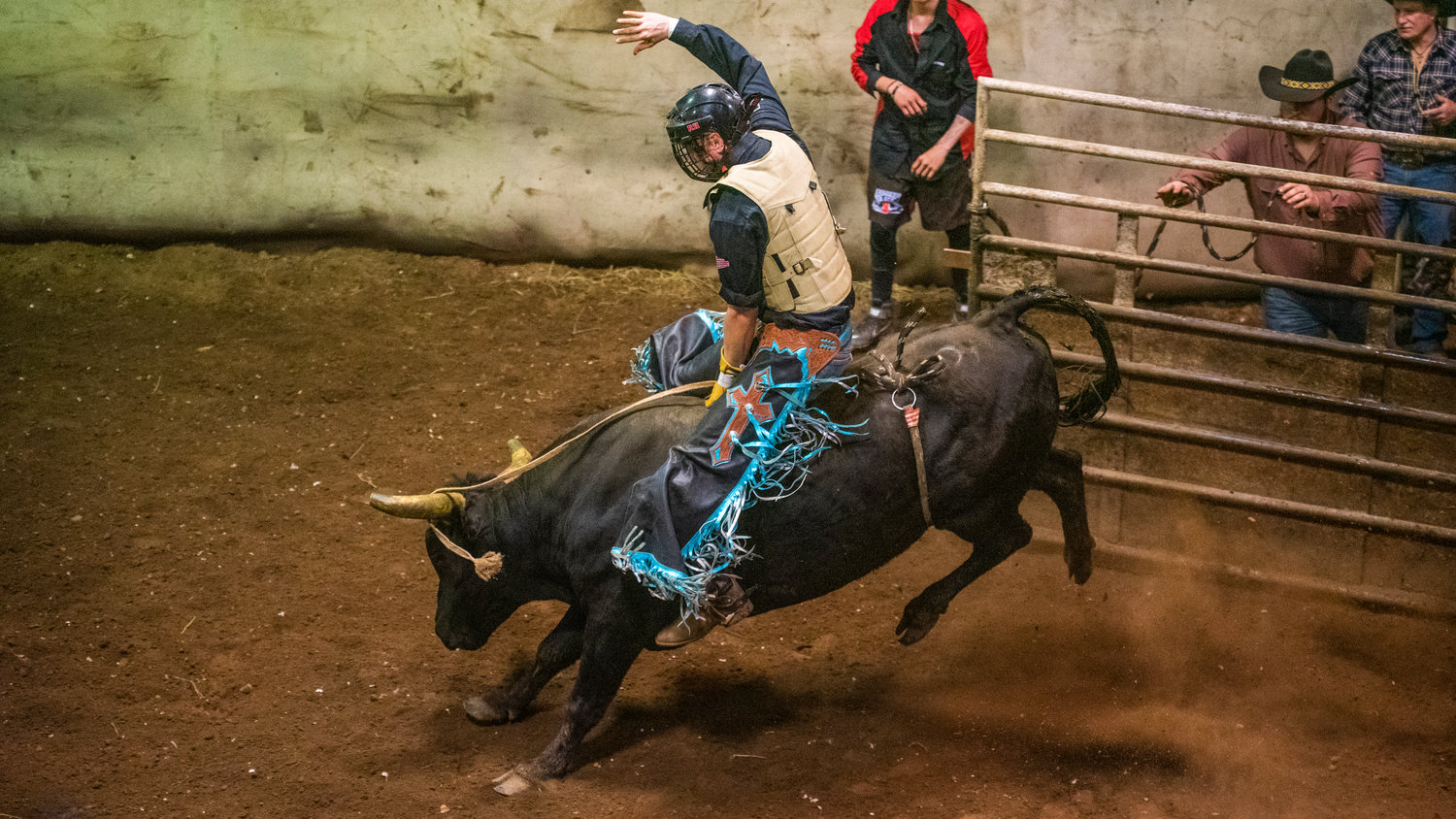Chaps fly as a rider attempts to stay on a bull during a Lazy HK Bar Rodeo Winter Series event Saturday in Silver Creek.