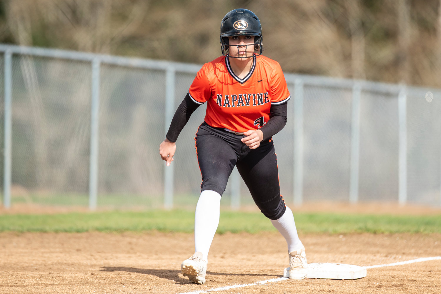 Napavine's Dani Tupuola (4) waits on third base for a La Center pitch during a home game on March 28.