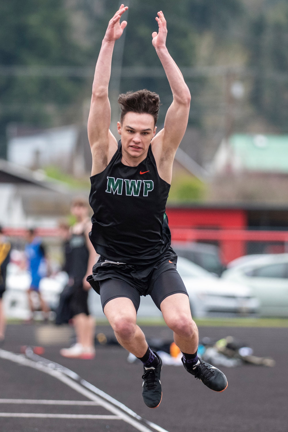 Morton-White Pass' Kysen Collette leaps in the boys long jump during a meet in Tenino on March 29.