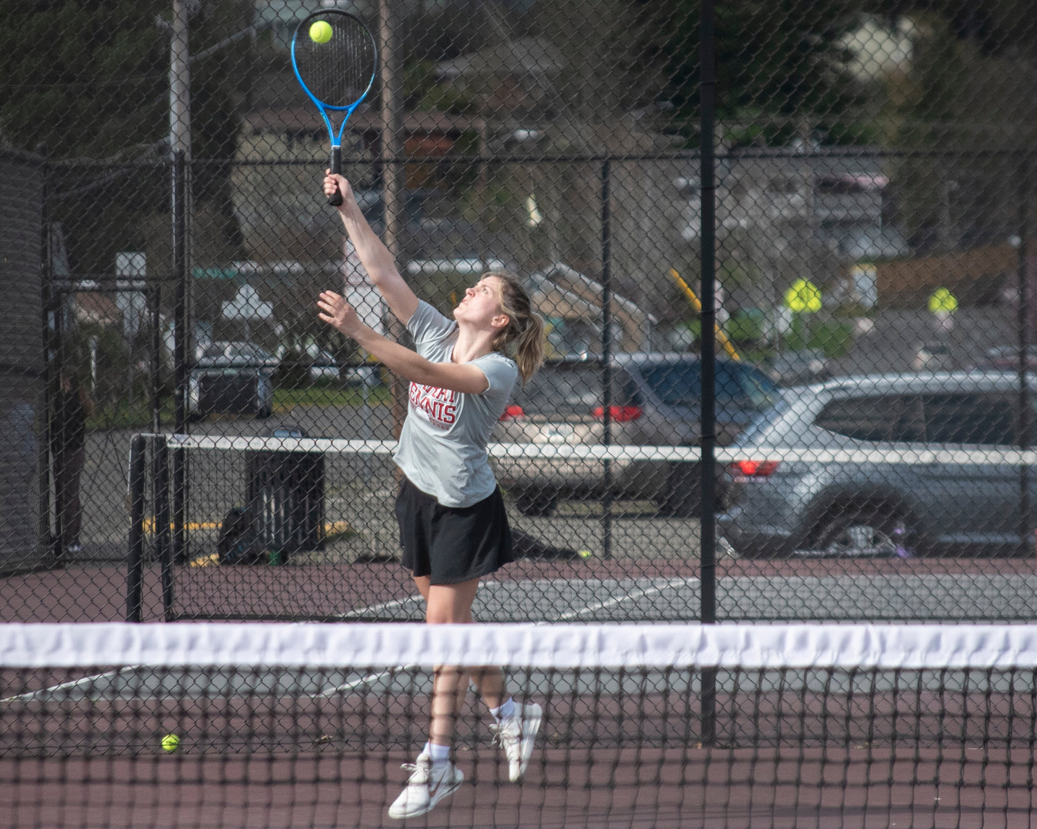 W.F. West’s first doubles player Kaylynne Dowling serves the ball during a match against Black Hills in Chehalis on Wednesday afternoon.