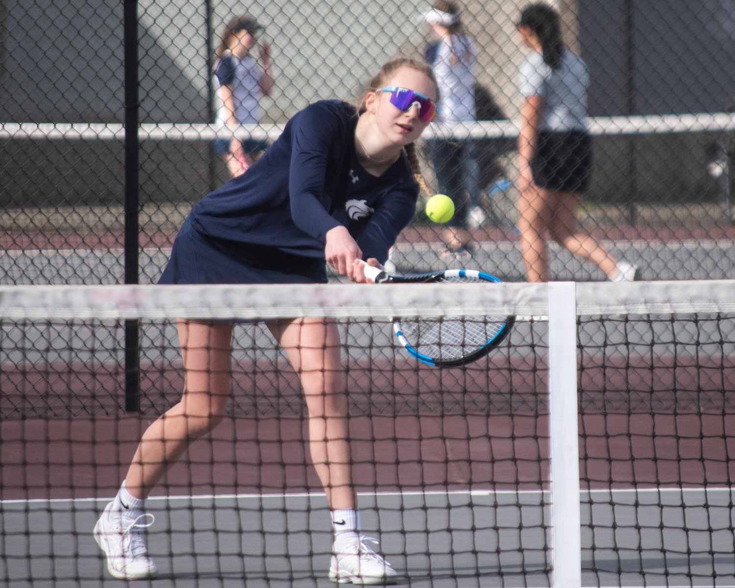 Black Hills’ second singles player Char Nieman hits a backhand during a match at W.F. West on Wednesday afternoon.