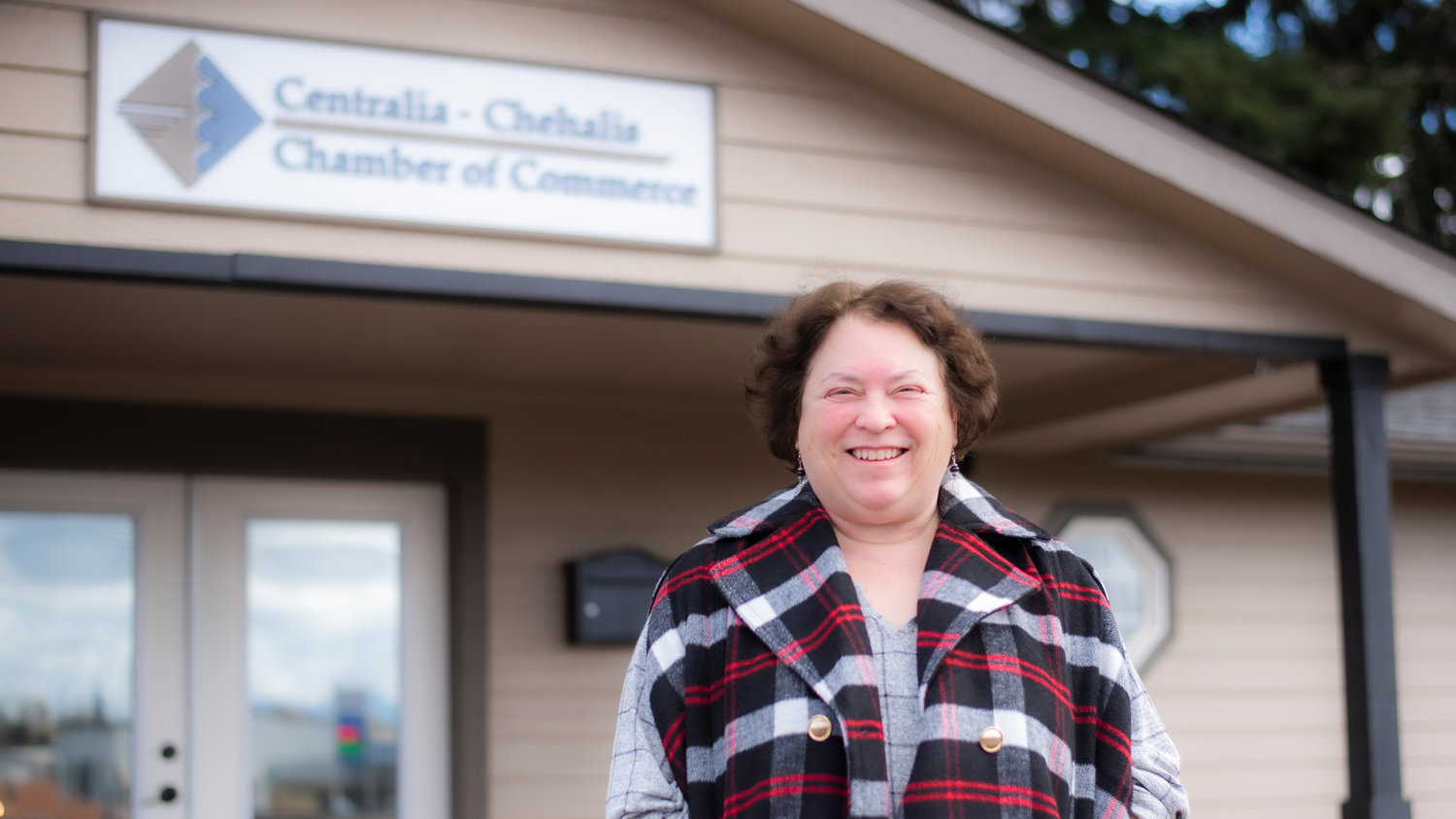 Director Cynthia Mudge smiles for a photo outside the Centralia-Chehalis Chamber office Thursday in Chehalis.