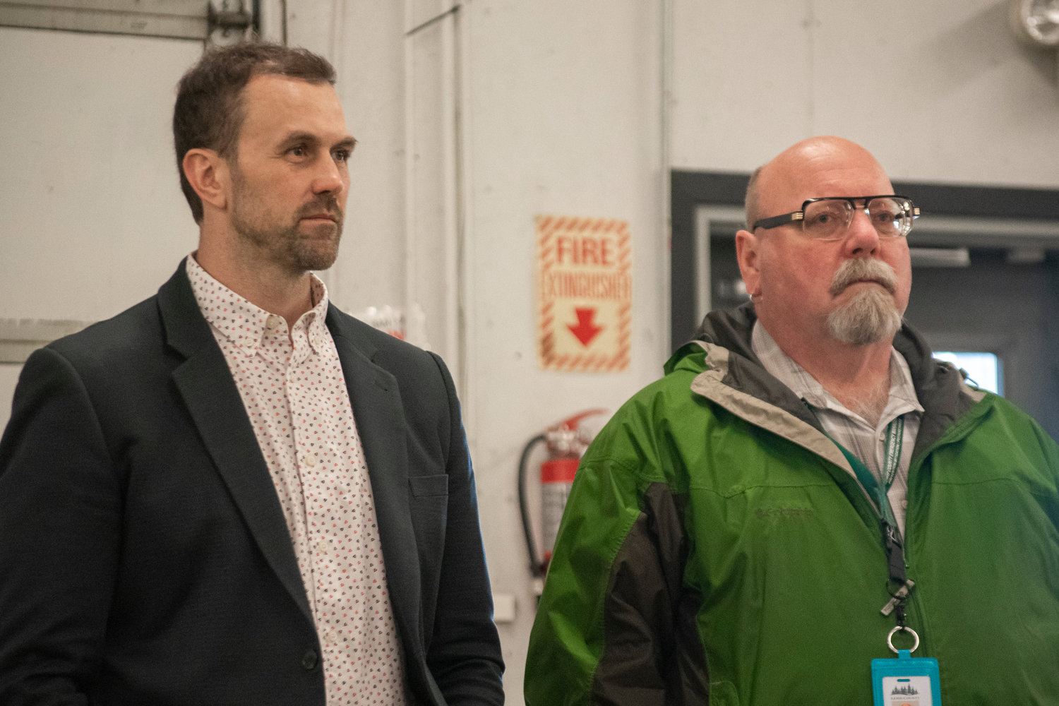 Lewis County Commissioner Sean Swope (left), and Department of Emergency Management Deputy Director Ross McDowell listen during a facilitated public forum on a proposed night-by-night shelter in Lewis County on Thursday night at the Southwest Washington Fairgrounds.