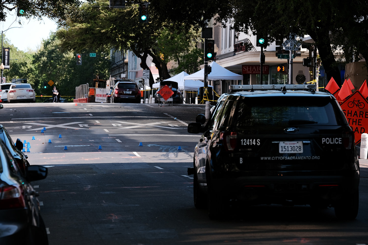 Police markers are placed in the street on the corner of 10th and L streets at the scene of a shooting that occurred in the early morning hours on April 3, 2022, in Sacramento, California. Six people were killed and 12 were injured. (David Odisho/Getty Images/TNS)