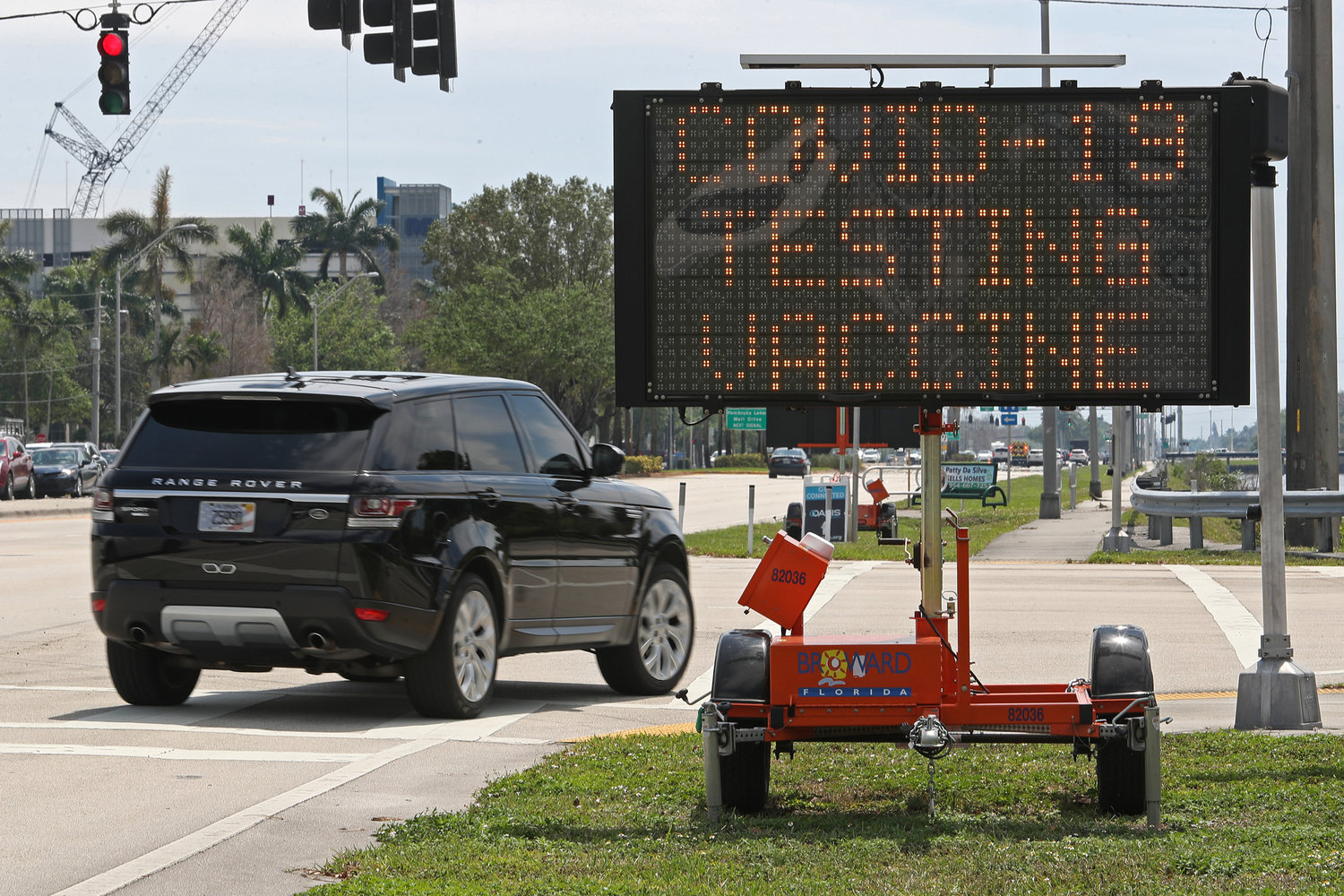A sign alerts drivers to the COVID-19 testing and vaccination site at C.B. Smith Park on March 25, 2022, in Pembroke Pines, Florida. (John McCall/South Florida Sun Sentinel/TNS)