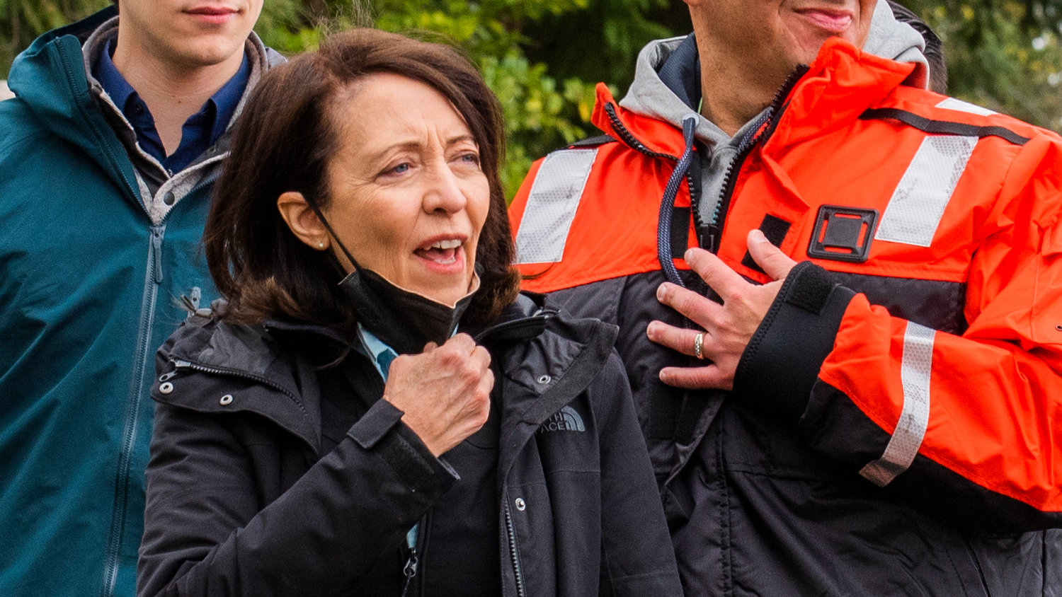 U.S. Senator Maria Cantwell lowers her mask as she is greeted before touring the Nisqually River by boat last April.