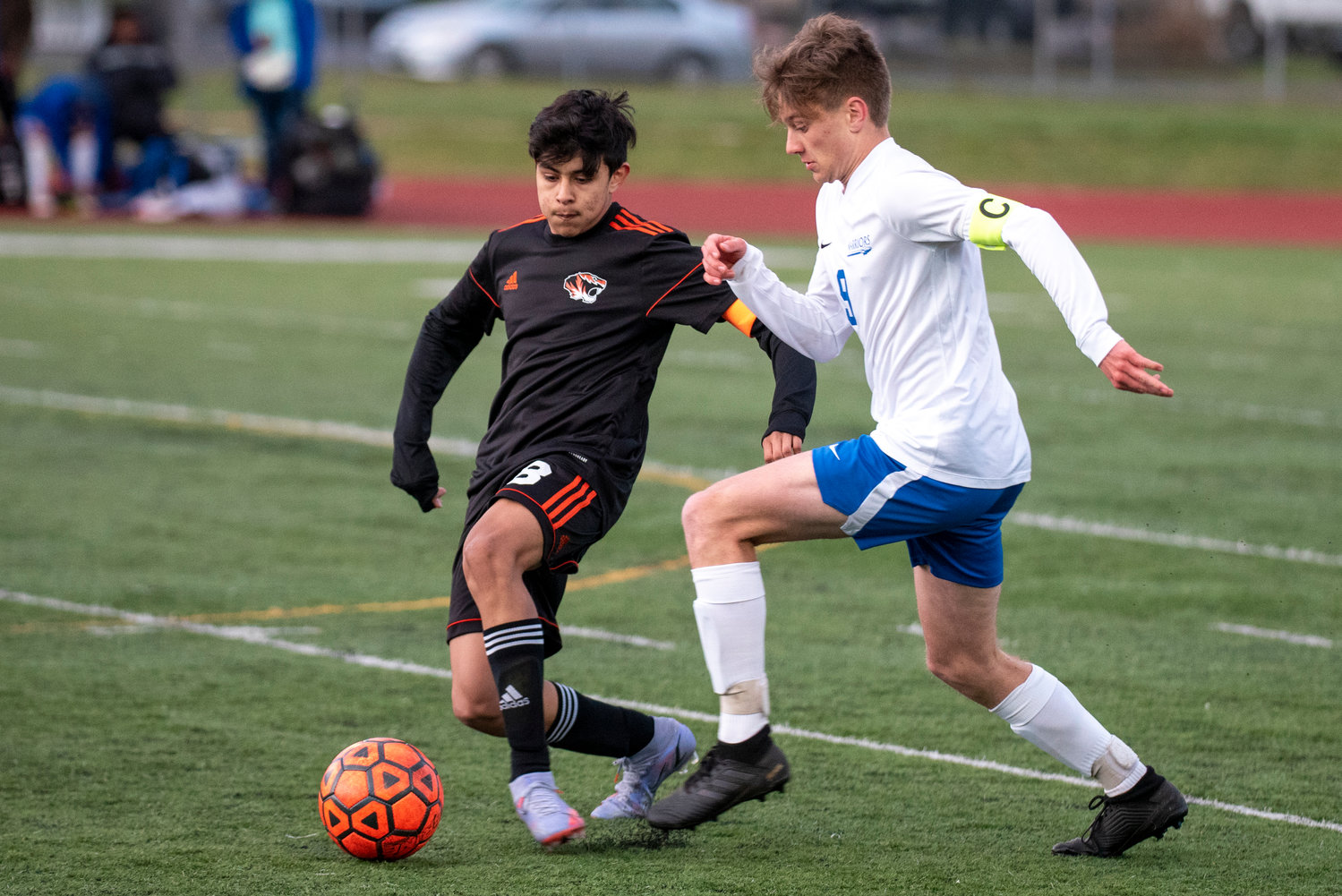 Centralia's Fernando Lopez (8) and Rochester's Levi Jennings (9) battle for possession during a league game in Centralia on Tuesday, April 12.